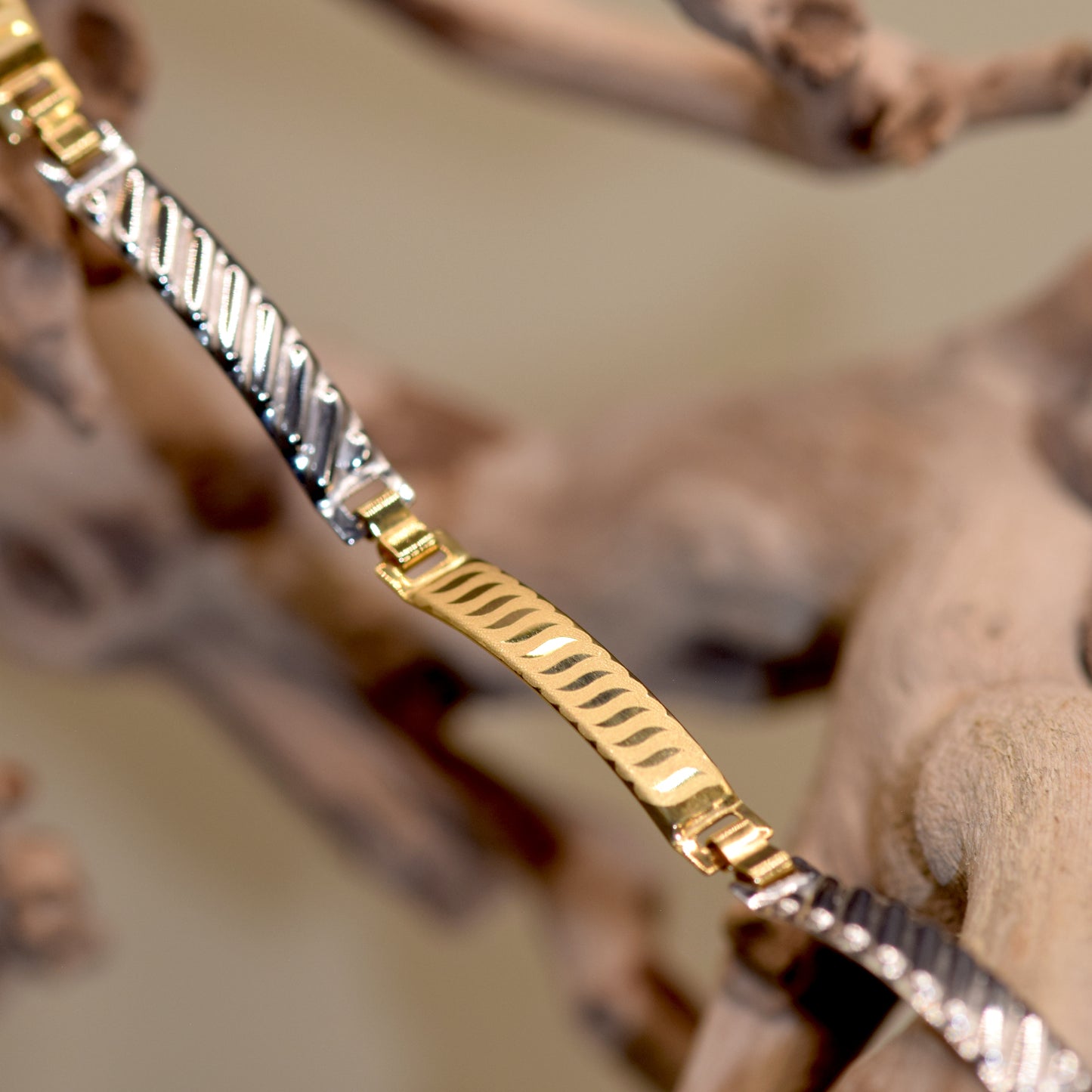 Bracciale piastre fantasy oro 18k